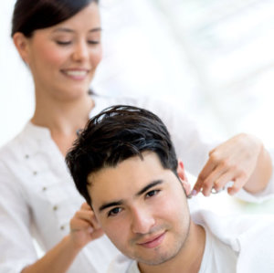 man getting a haircut at the hair salon